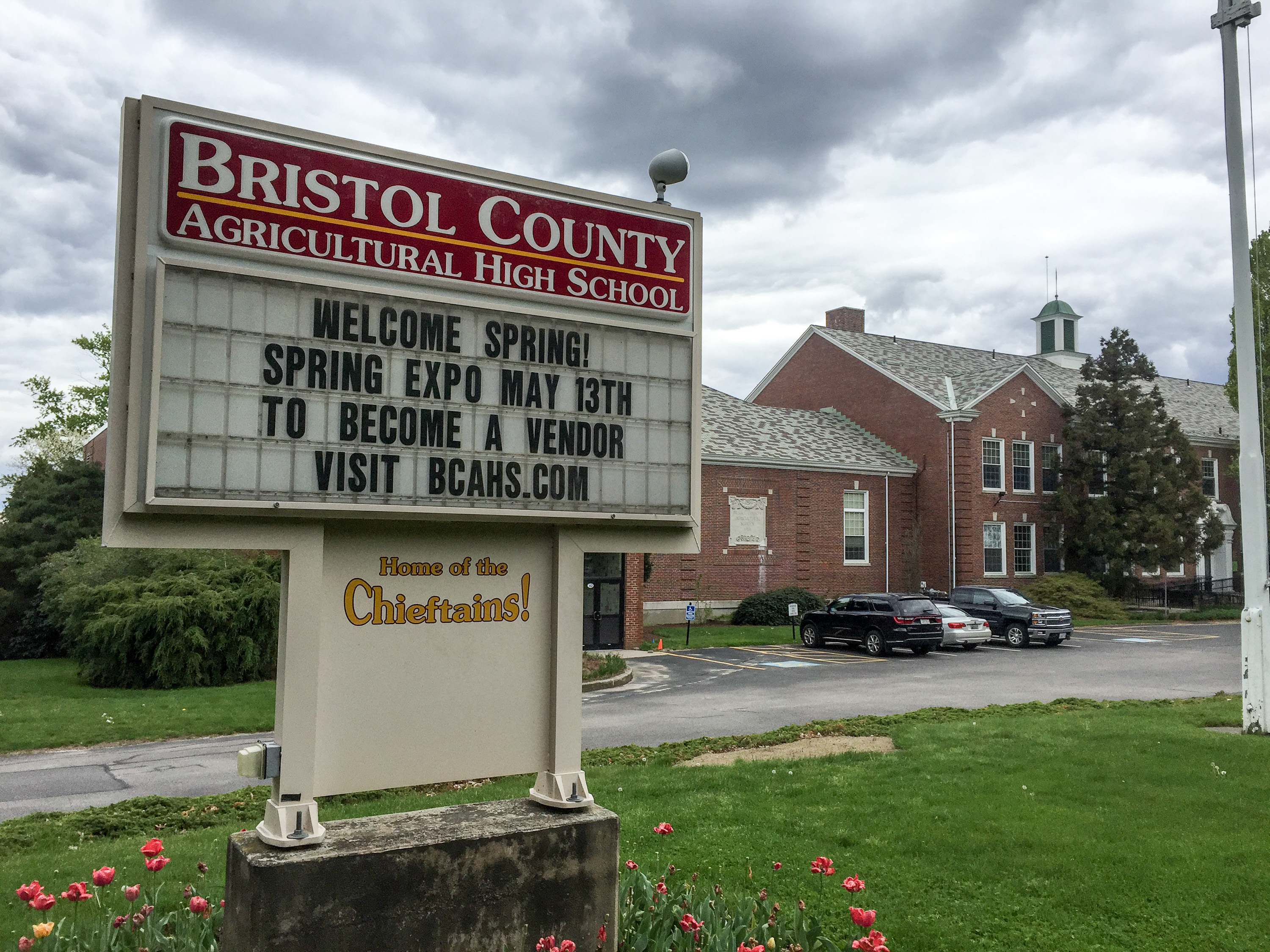 The Bristol County Agricultural High School sign and a brick school building in 2017, before the later campus renewal.